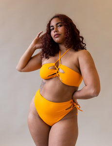 asymmetric cut out bikini top in orange from saga